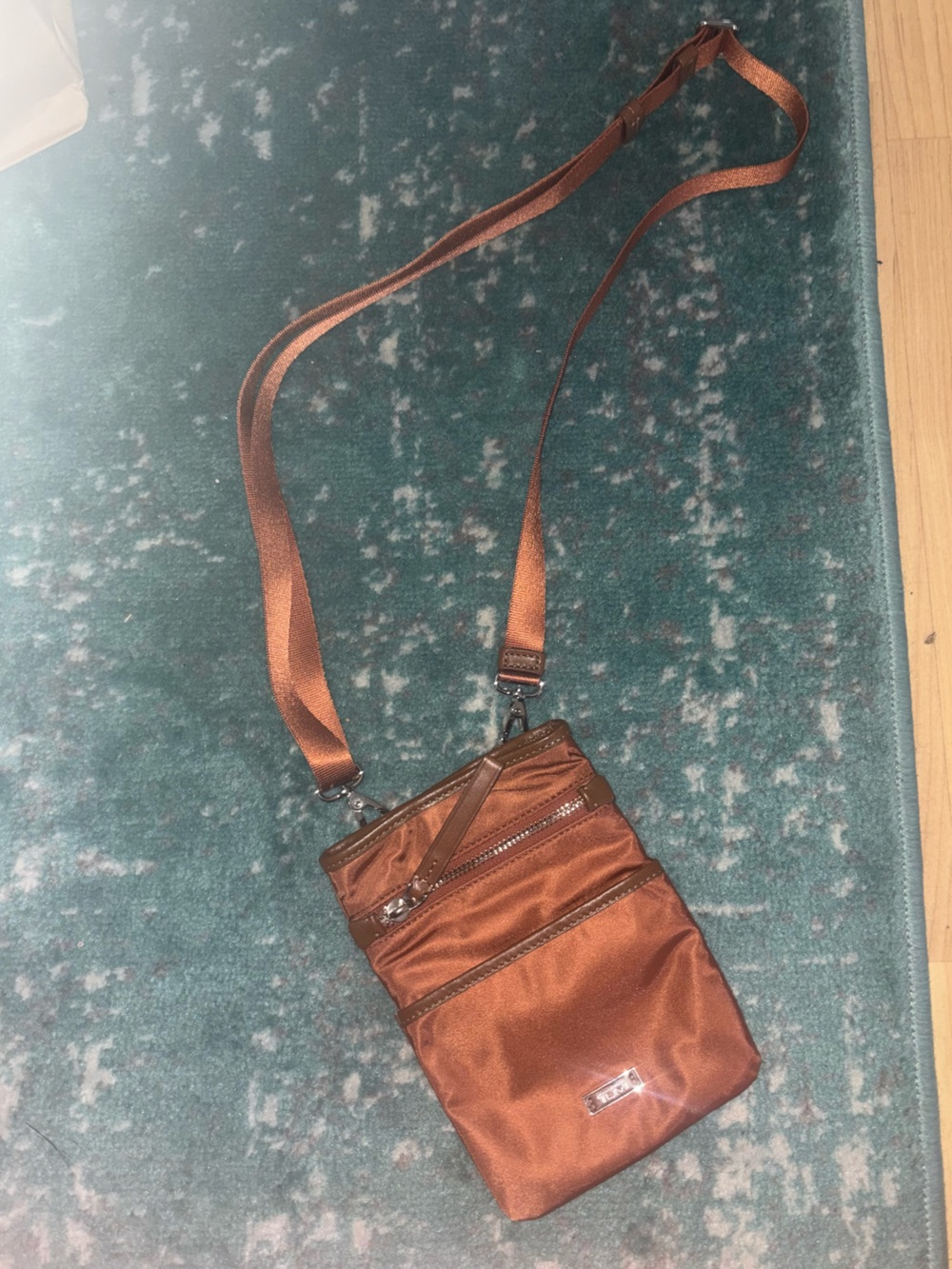 Tumi orange crossbody bag